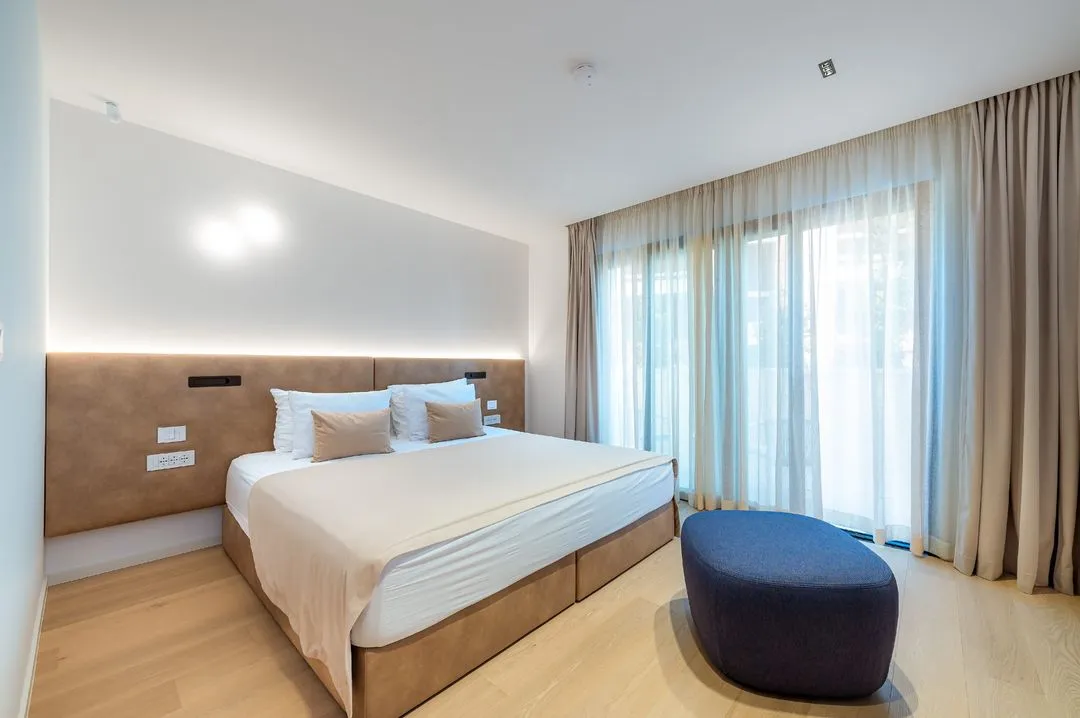 Bedroom with a double bed and long curtains