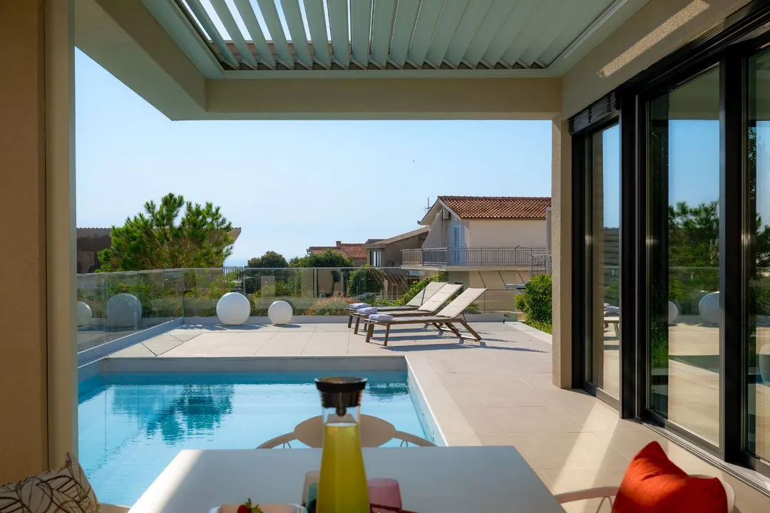 Living room opening onto the pool