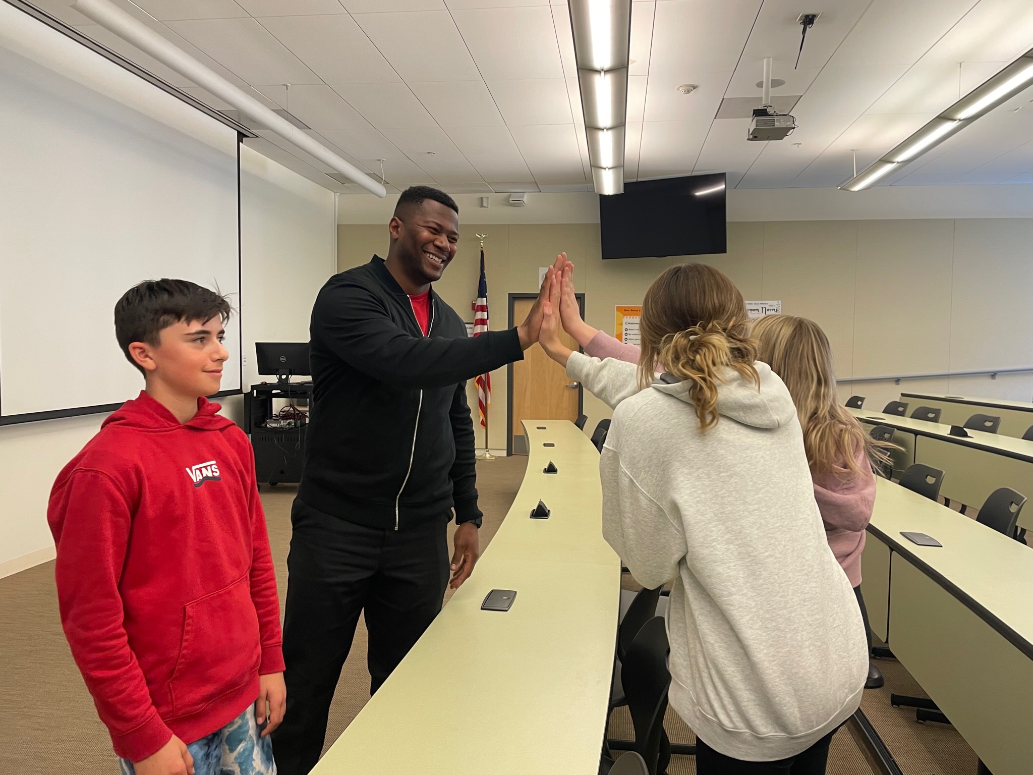 Daniel speaking to students in classroom