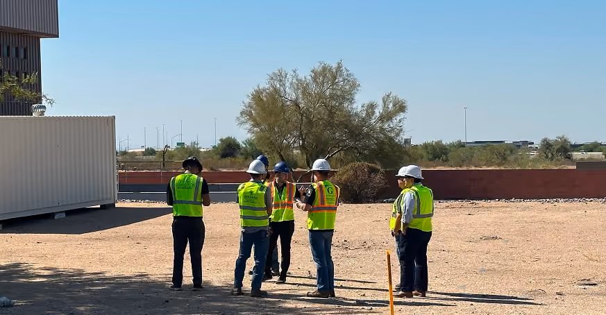Cambridge team on site at the three month walk through