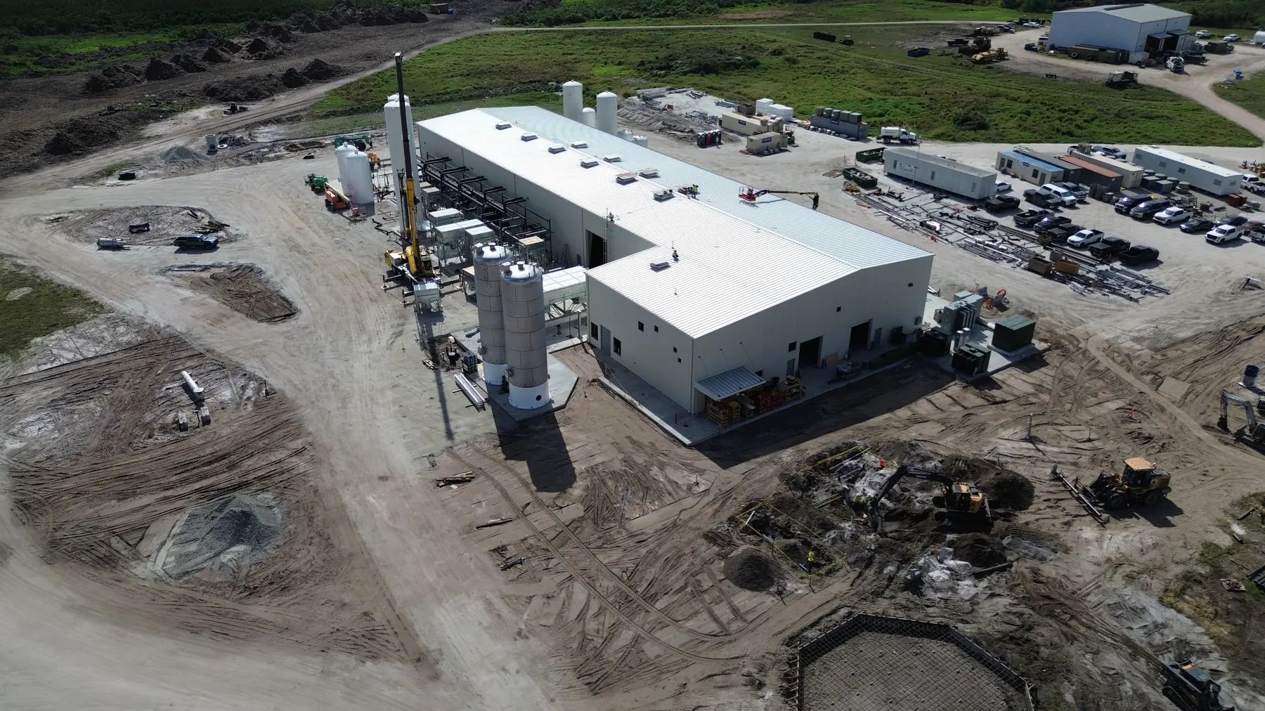 Aerial view of the Okeechobee RNG facility under construction with a crane on site