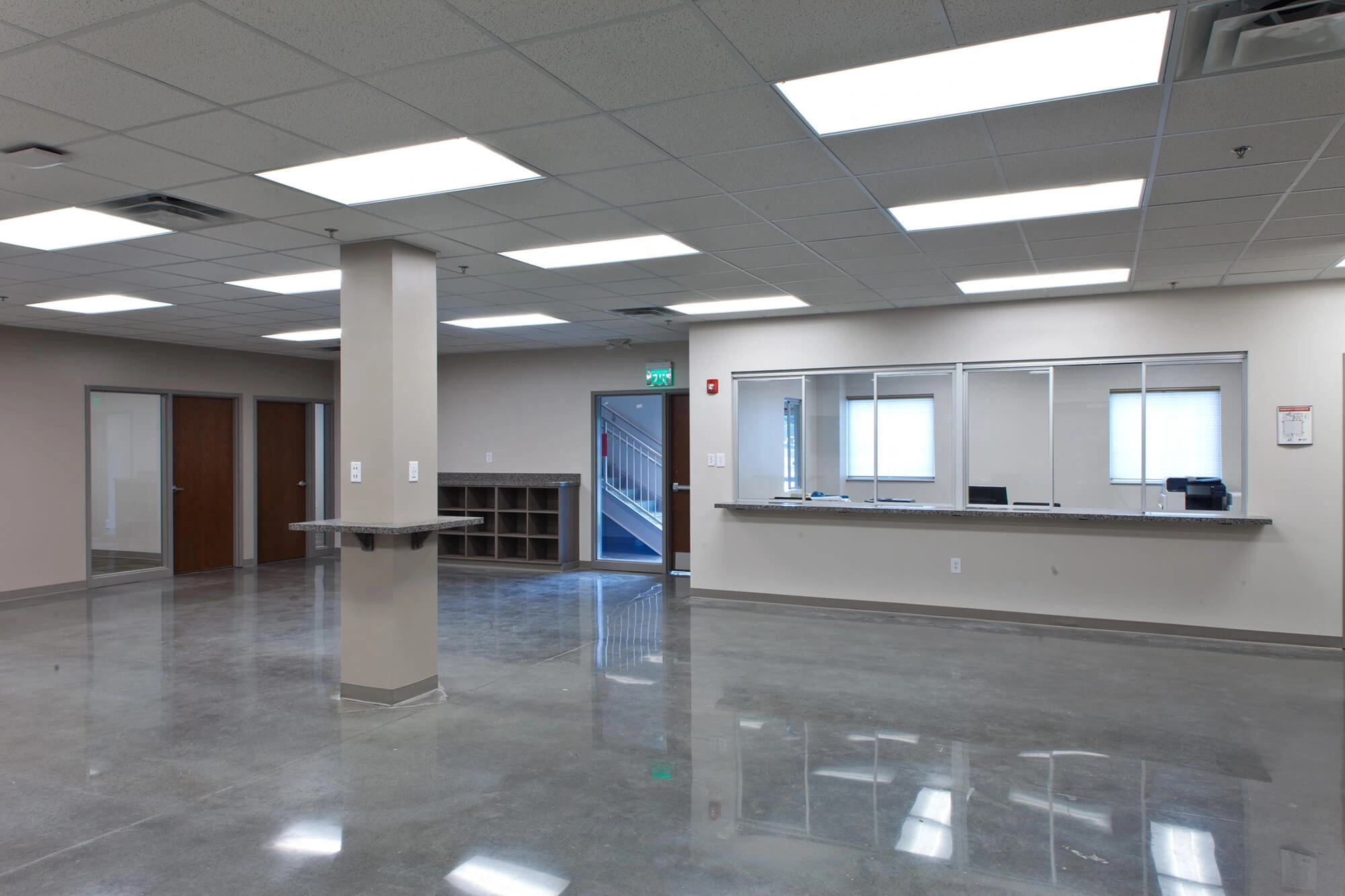 Open interior of the Cobb County shop office area with a service window