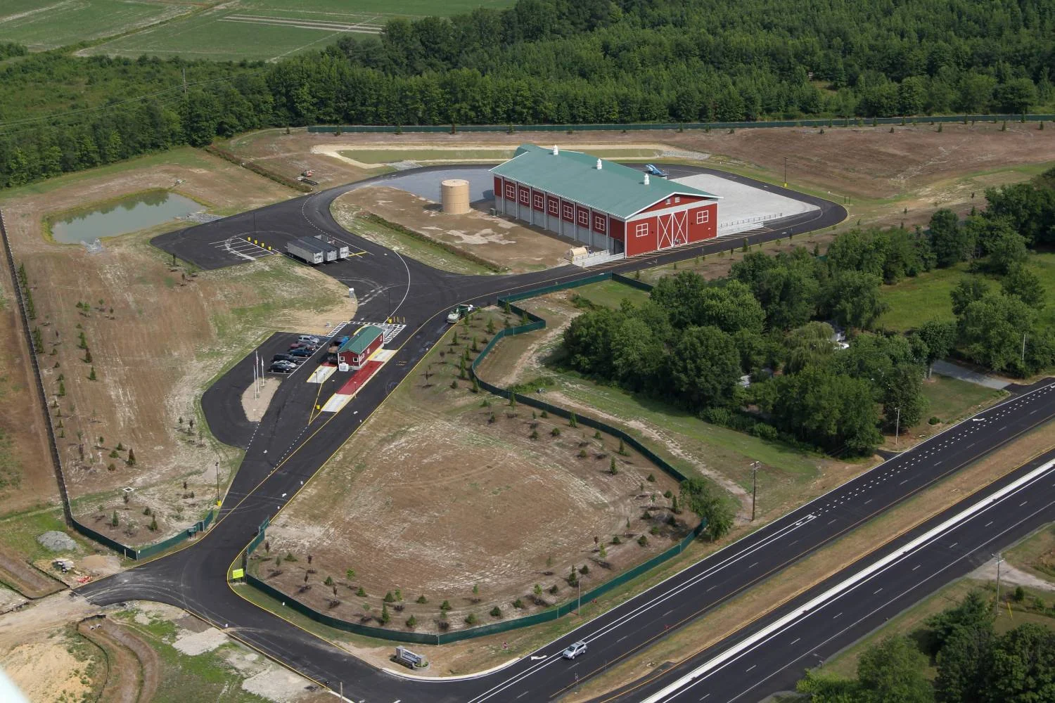 Aerial view of the Farmington transfer station site with stormwater basins and highway access