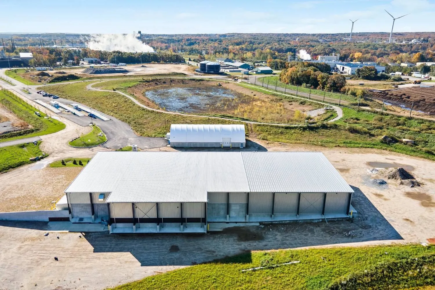 Aerial view of the RIRRC transfer station with wind turbines on the horizon