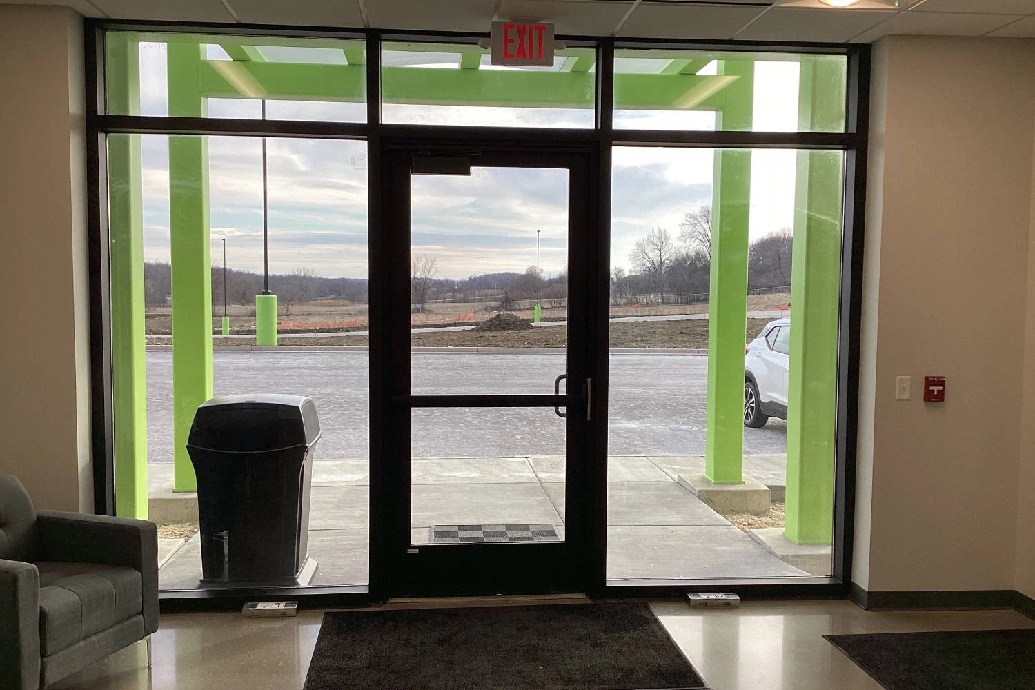 Glass entry vestibule with green painted steel at the Horicon recycling center