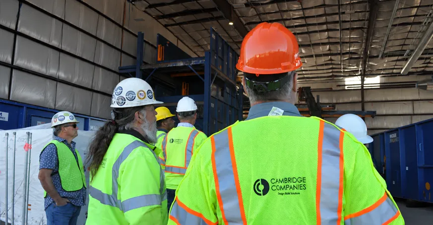 Cambridge Companies team meeting a solid waste facility for a site visit.