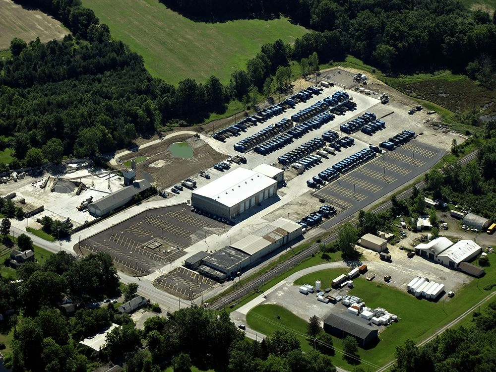 Aerial view of the Elyria truck maintenance facility with rows of parked collection trucks