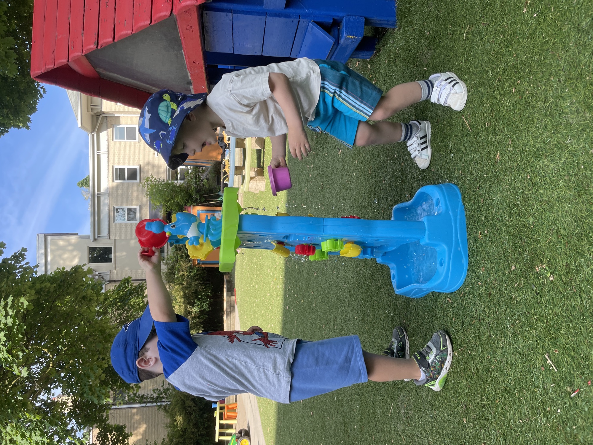 Children at the water table at summer camp
