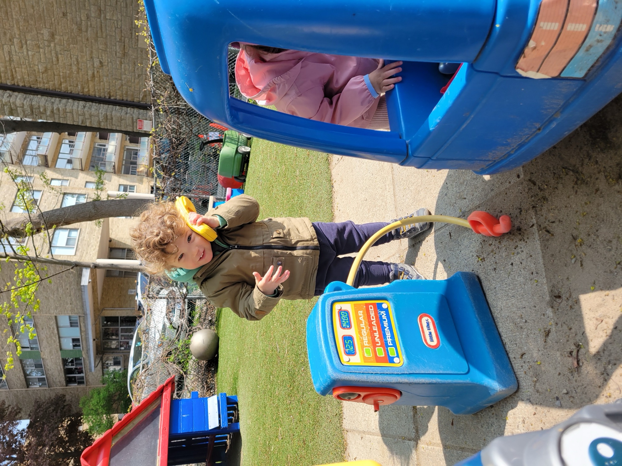 Children at the play gas pump outdoors
