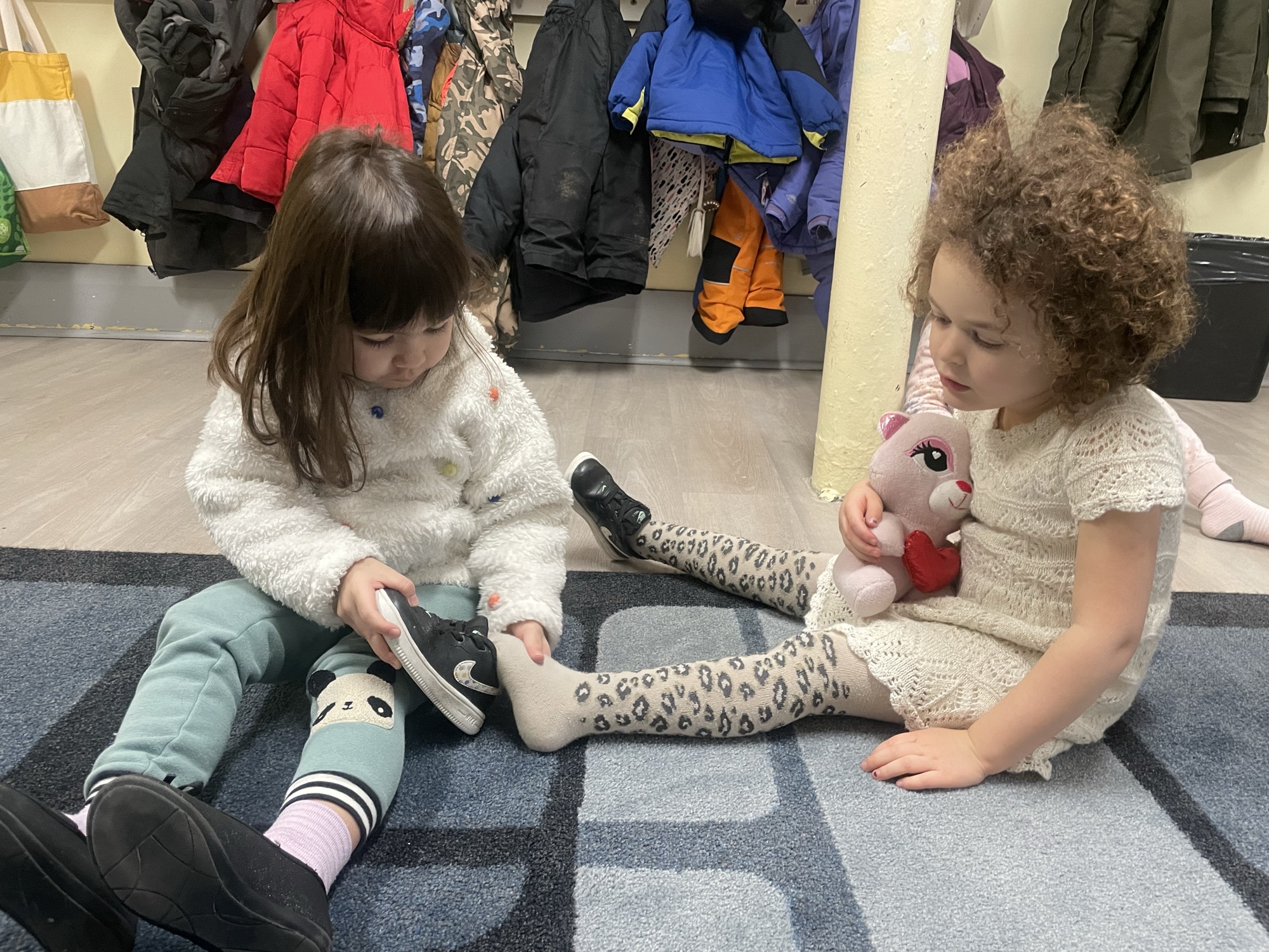 Shoes and cubbies at arrival