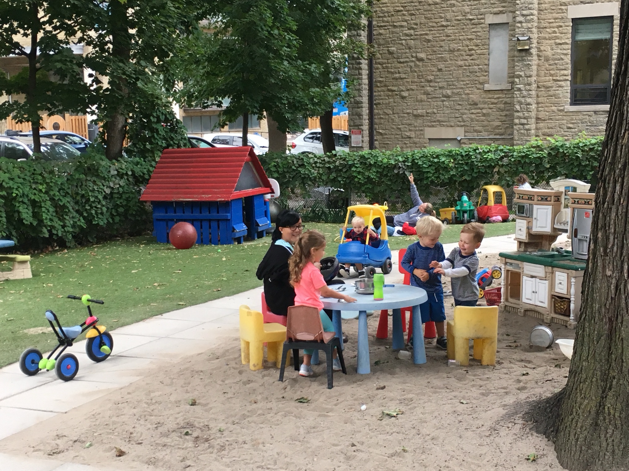 Children building sandcastles at summer camp