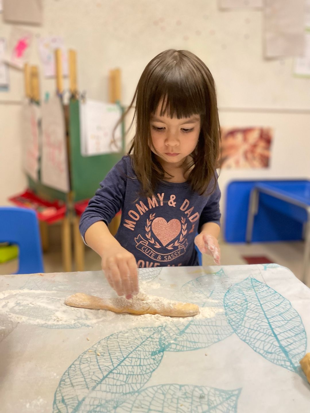 Children working with playdough at the table