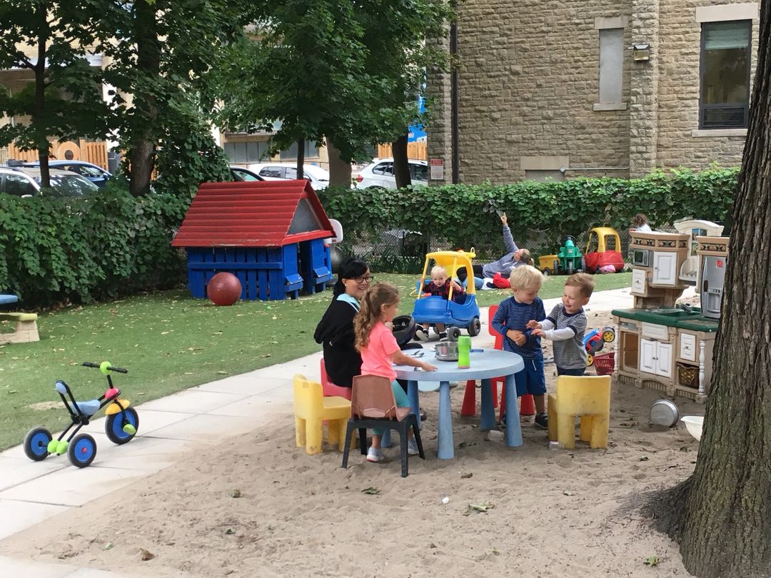 Children building sandcastles at summer camp
