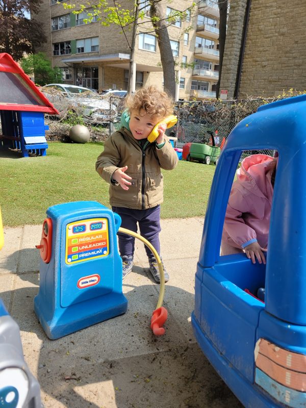 Children at the play gas pump outdoors