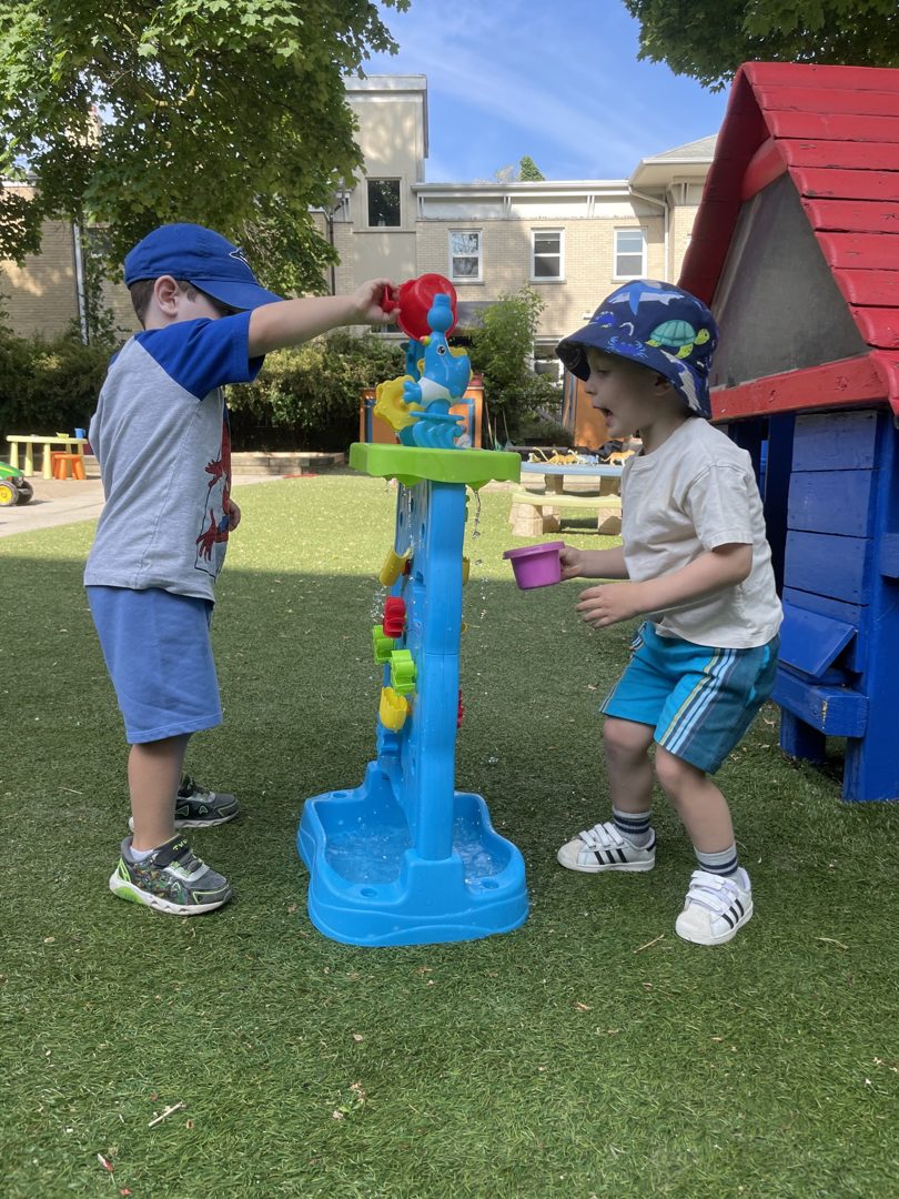Children at the water table at summer camp