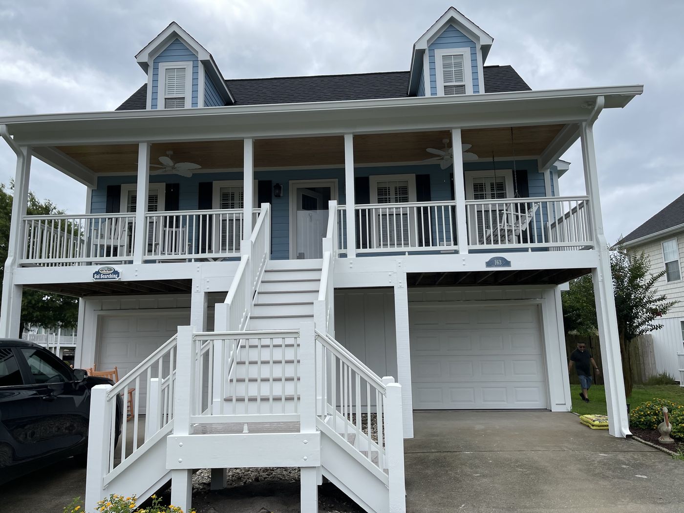 Coastal cottage with double porches and custom stairs — Daybreak Construction