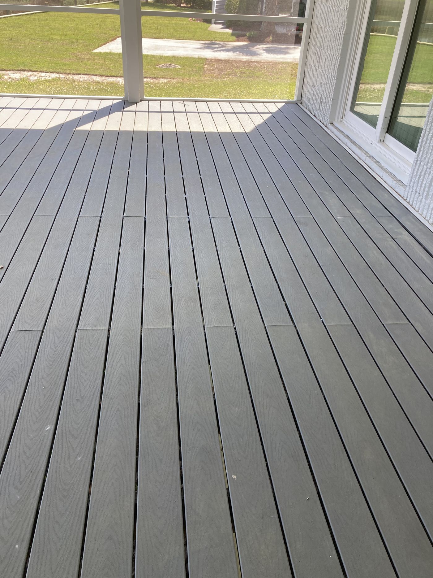 Composite deck boards on a covered porch — Daybreak Construction