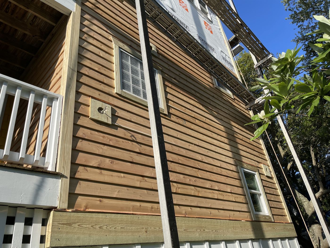 Wood lap siding installation in progress — Daybreak Construction