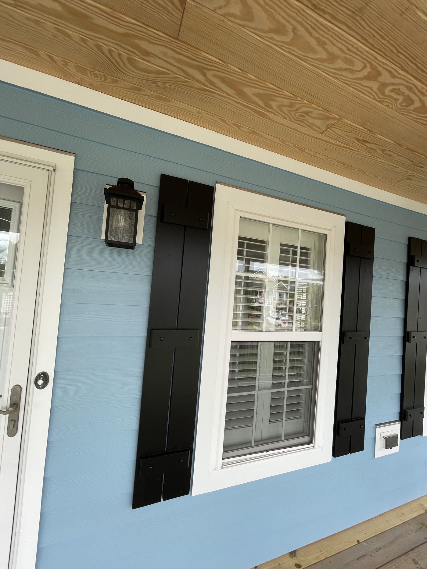 Lap siding with custom shutters and trim detail — Daybreak Construction
