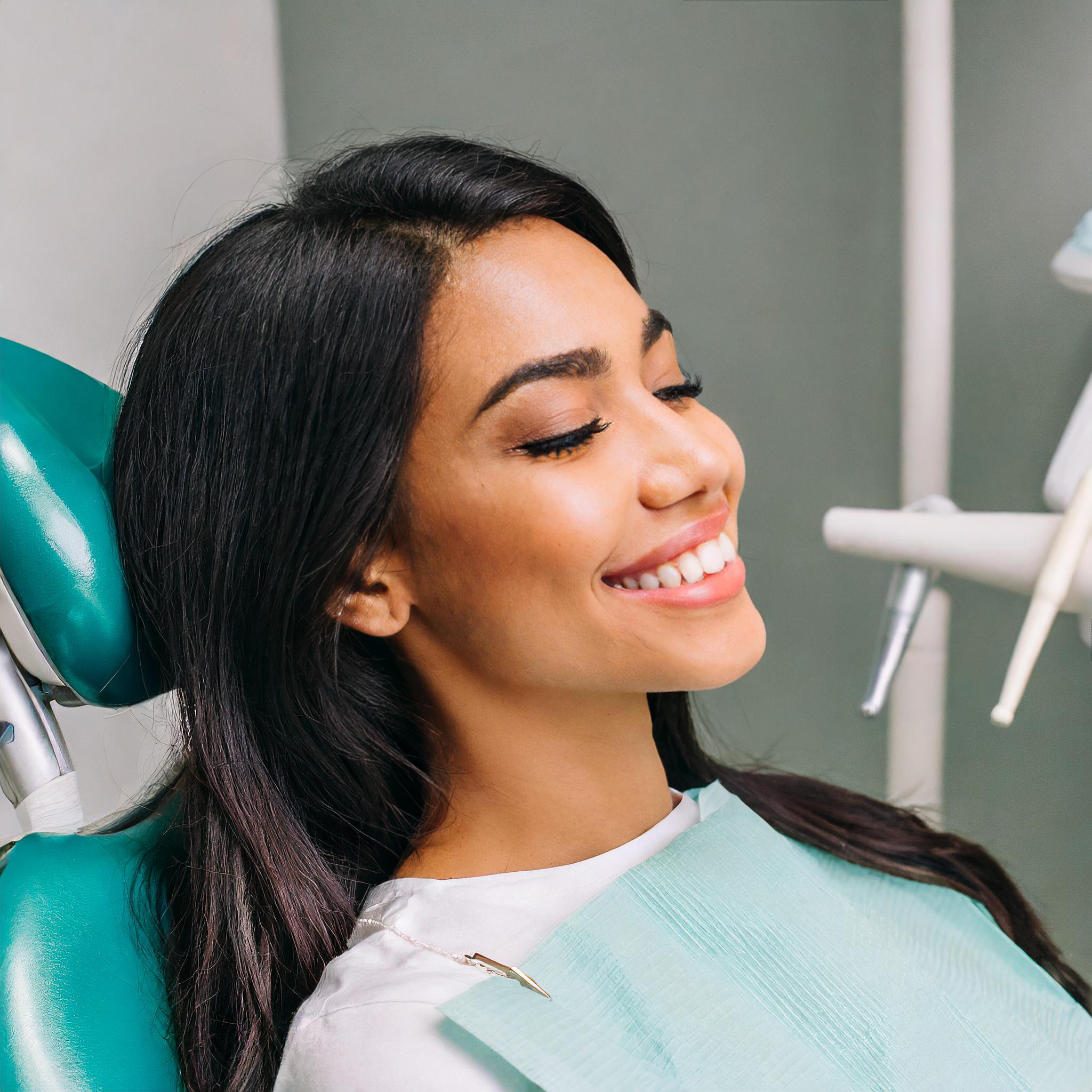 woman smiling in dentist chair