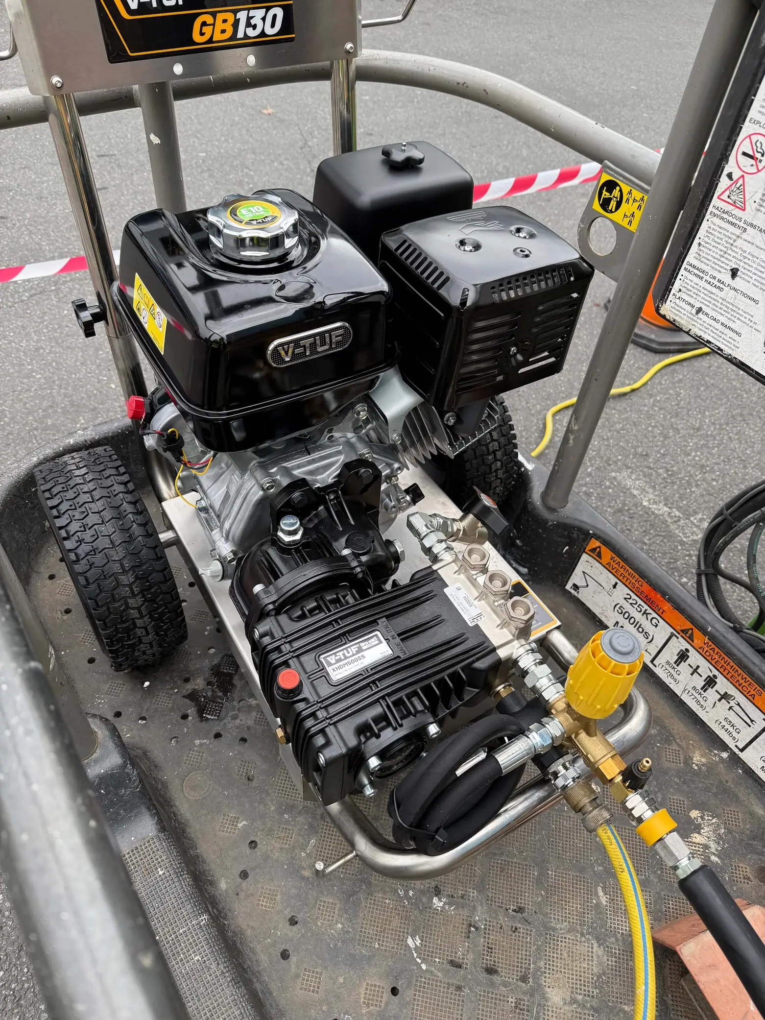 Close-up of a V-TUF GB130 industrial engine and pressure washer unit on a wheeled platform.