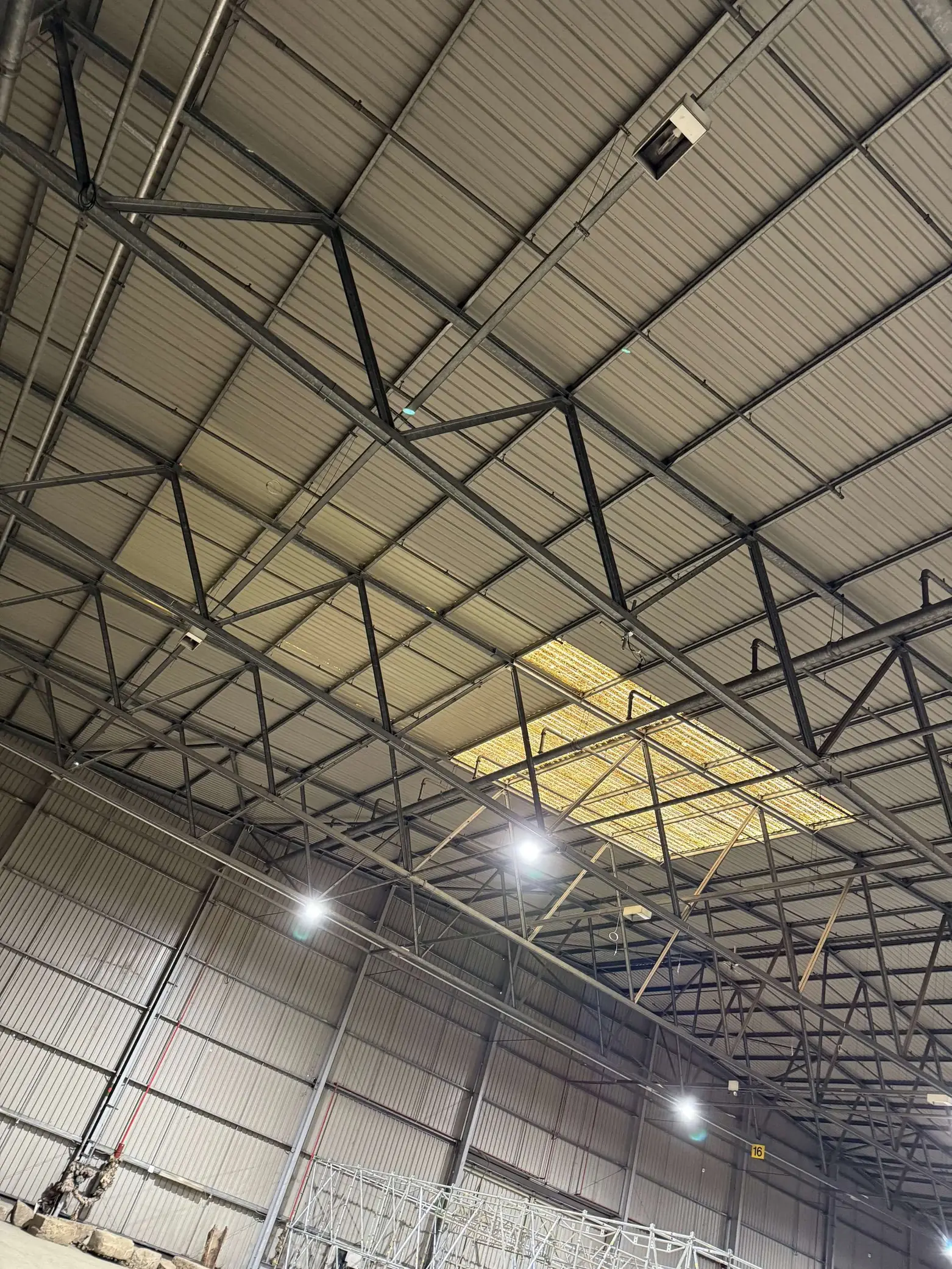 Steel roof trusses, rooflights and lighting inside Deptford Store House