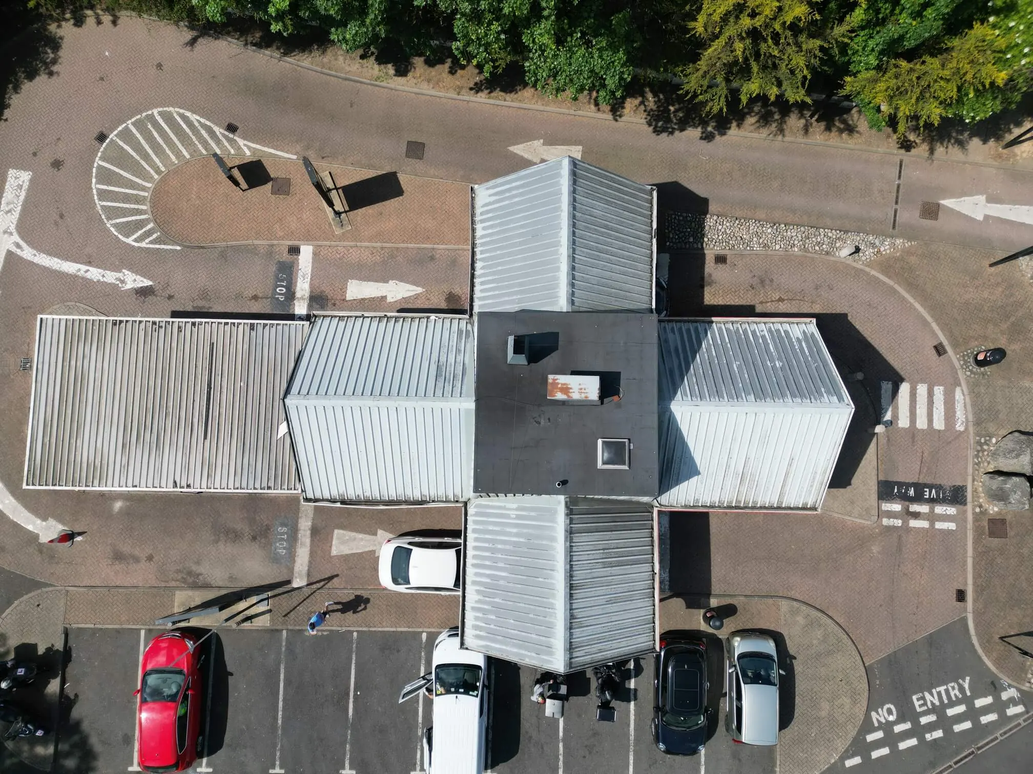 Overhead view of the different roof sections and roof-mounted equipment at a restaurant.