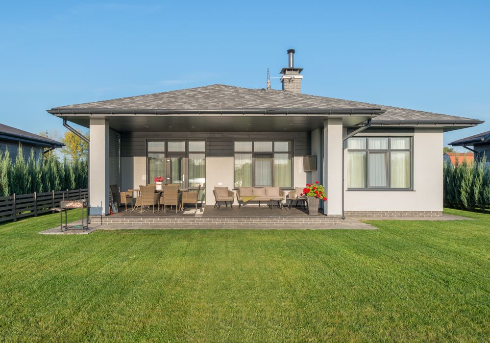 House backyard with green lawn