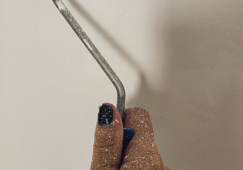 Paint roller closeup on wall