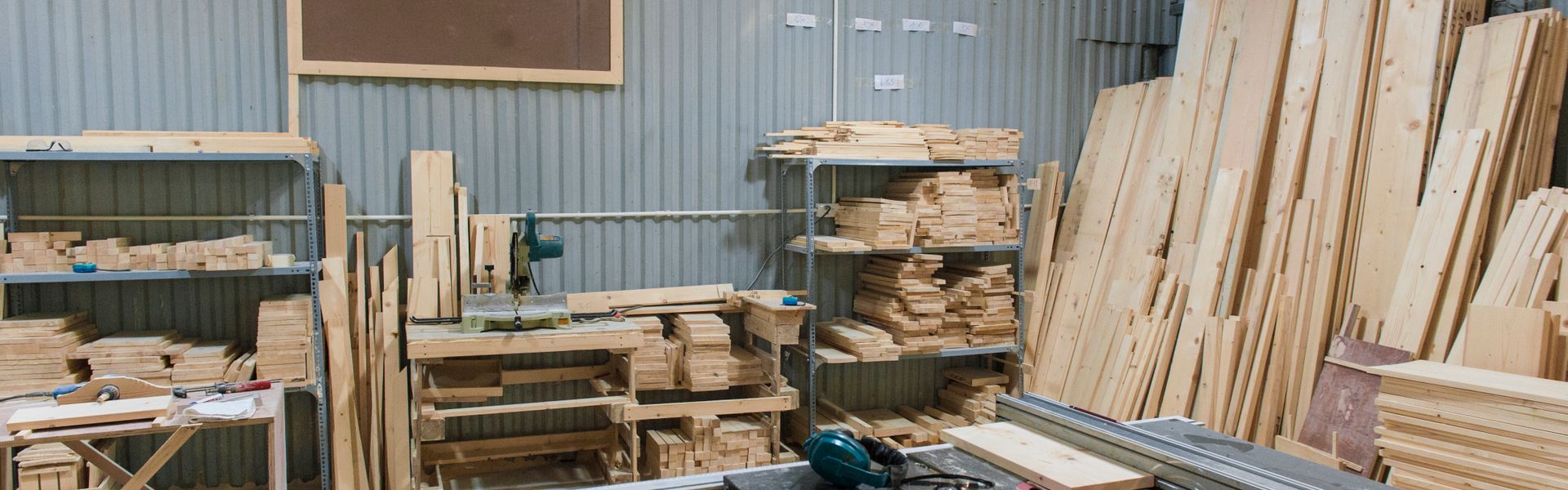 Wood workshop with lumber and carpentry tools