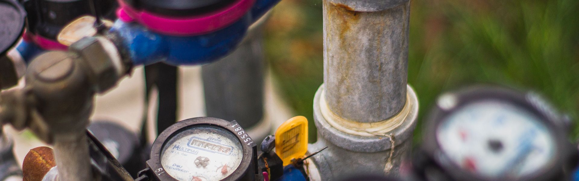 Water pressure gauges and pipes outdoors
