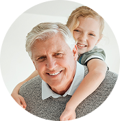 A kid embracing a grandparent
