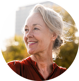 A woman smiling in the sunlight