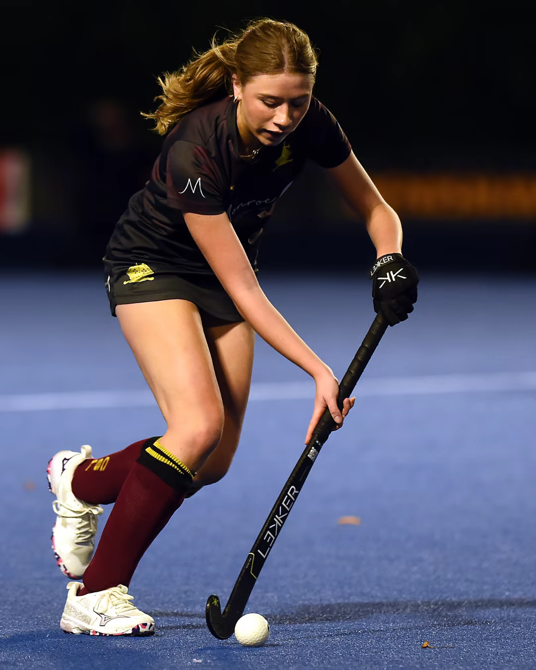 Phoebe McCarroll controlling the ball during a field hockey match
