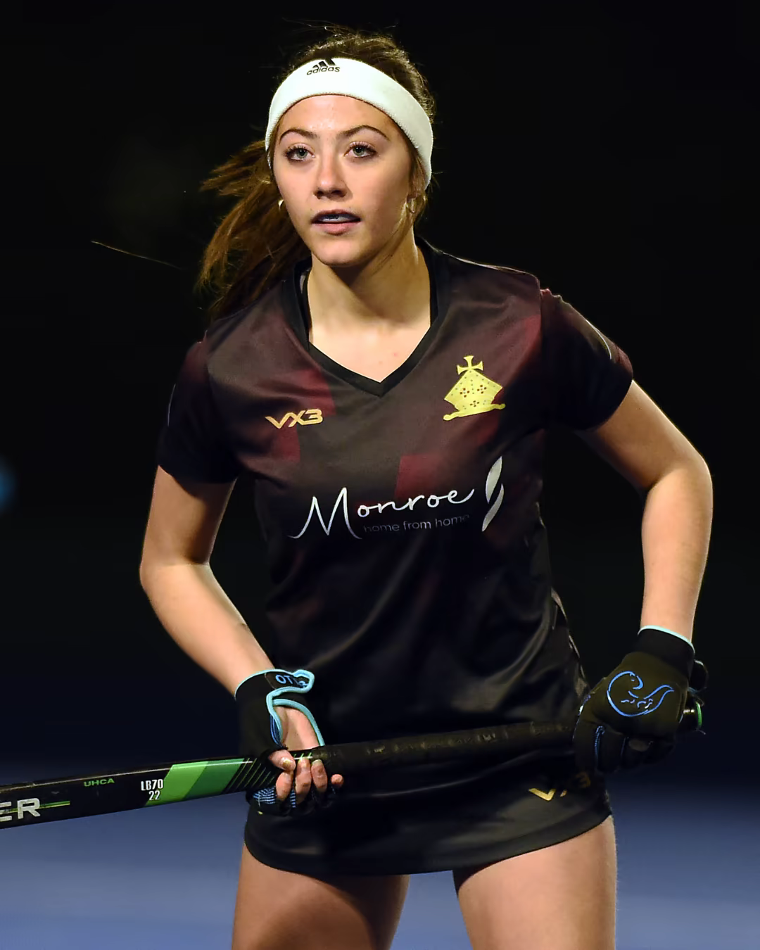 Sylvie McCarroll playing field hockey