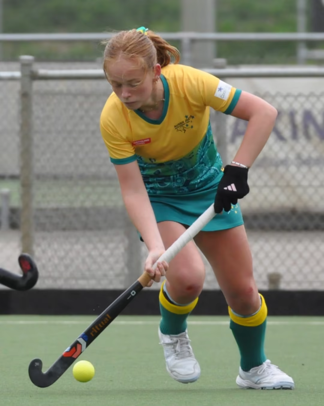 Phoebe Blake playing field hockey