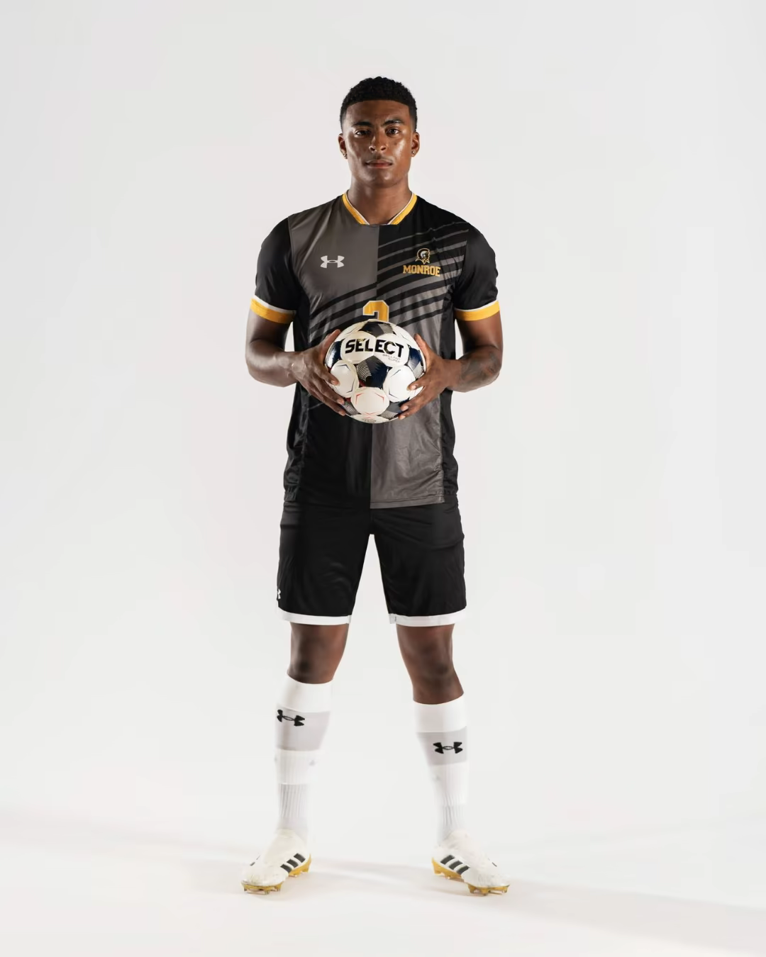 Elijah Breidel holding a soccer ball