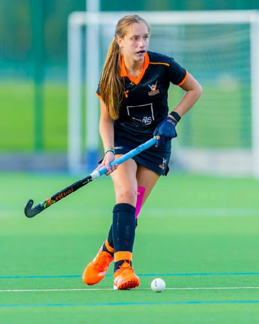 Elsa Green playing field hockey