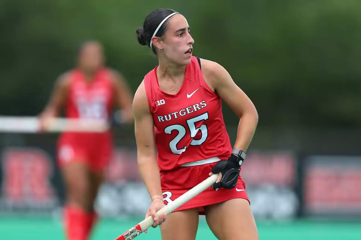 Eden Doucelin playing college field hockey