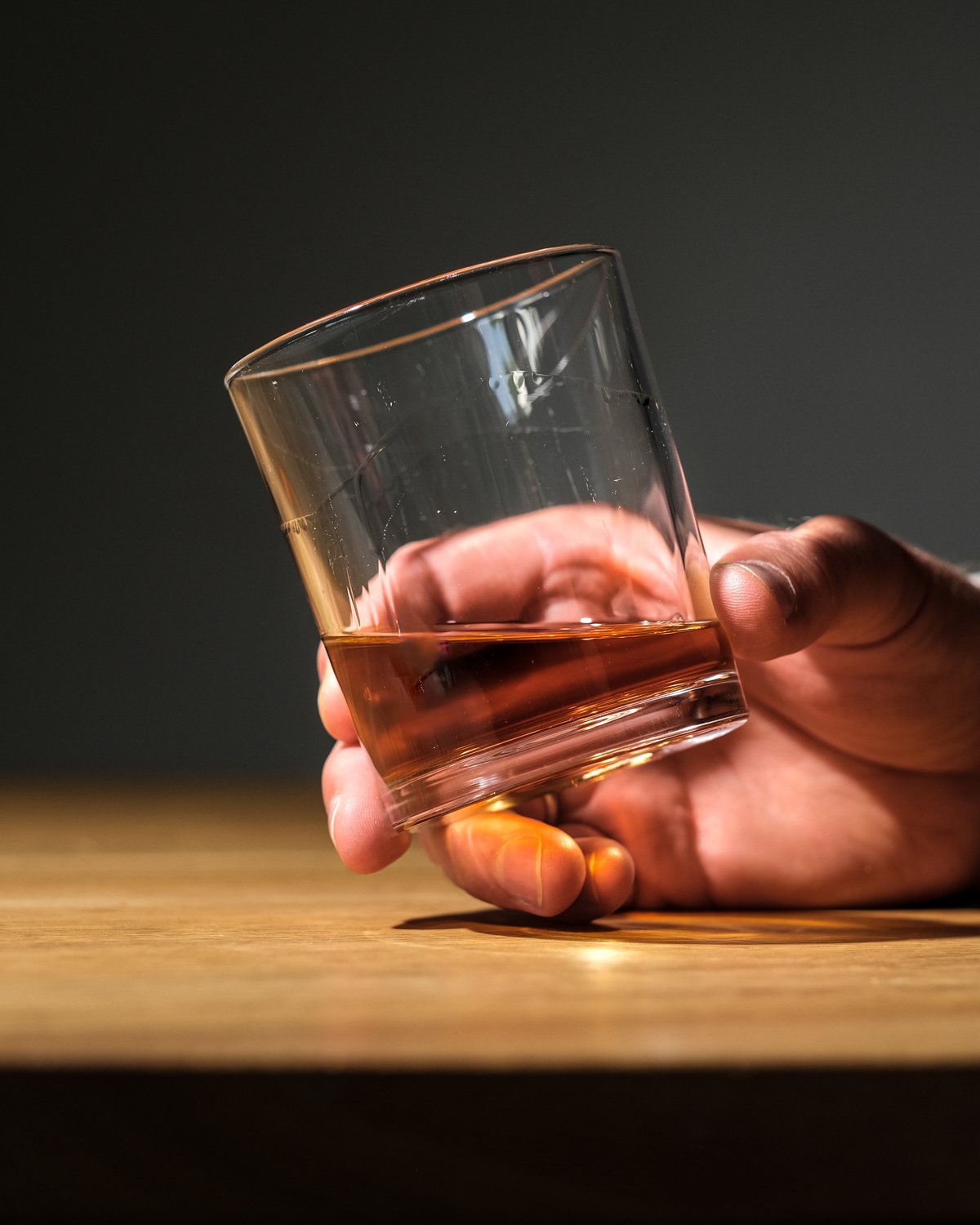 Whisky glass held in hand