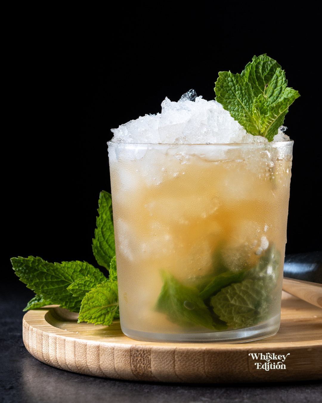 Mint Julep in a glass of crushed ice, garnished with a mint bouquet