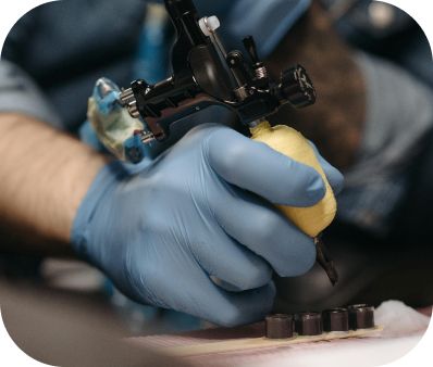 Tattoo artist preparing equipment