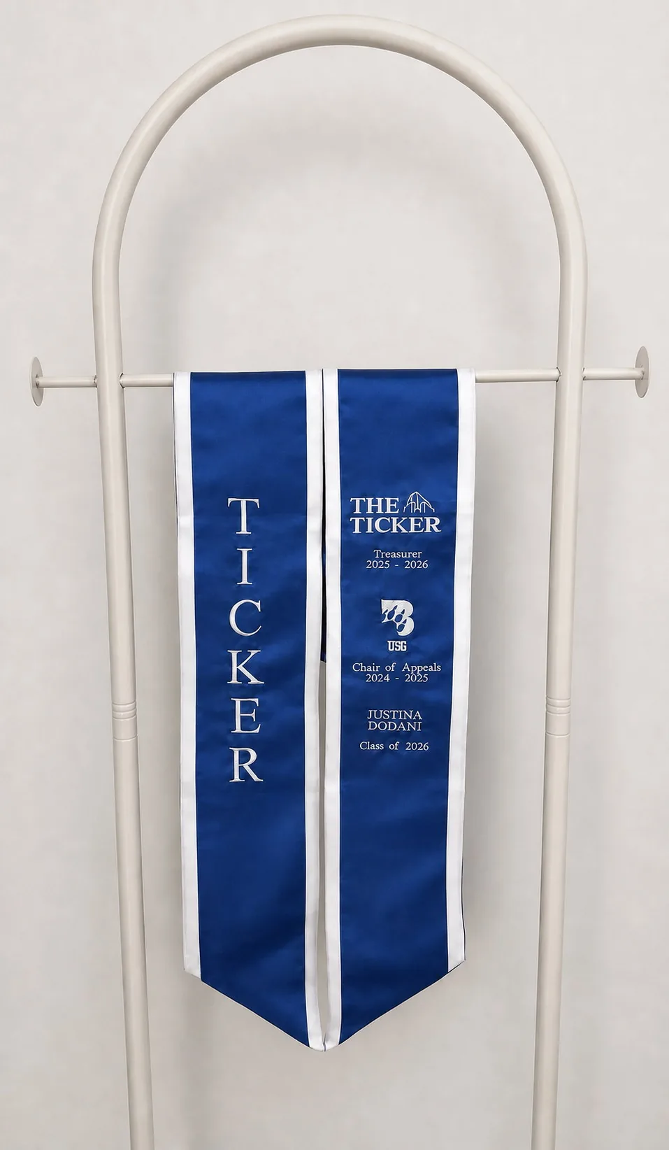 The Ticker. Royal satin · White trim.