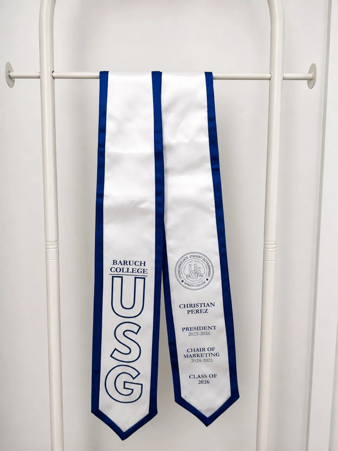 USG stole. White satin · Royal trim.