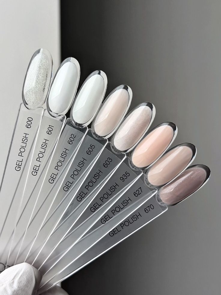 Labeled gel polish swatch sticks in soft neutral shades