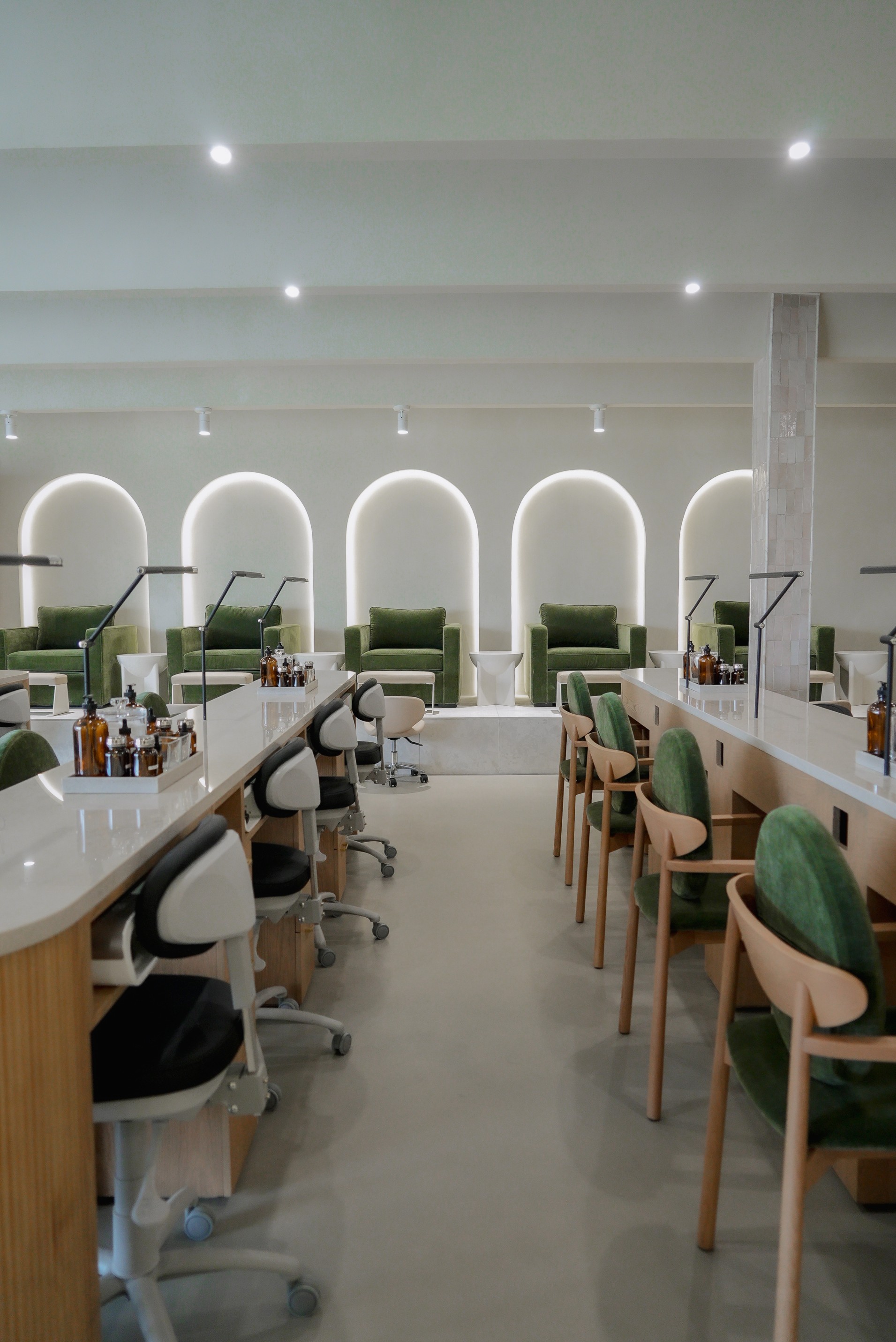 A row of manicure stations inside the Earth Nail Spa studio