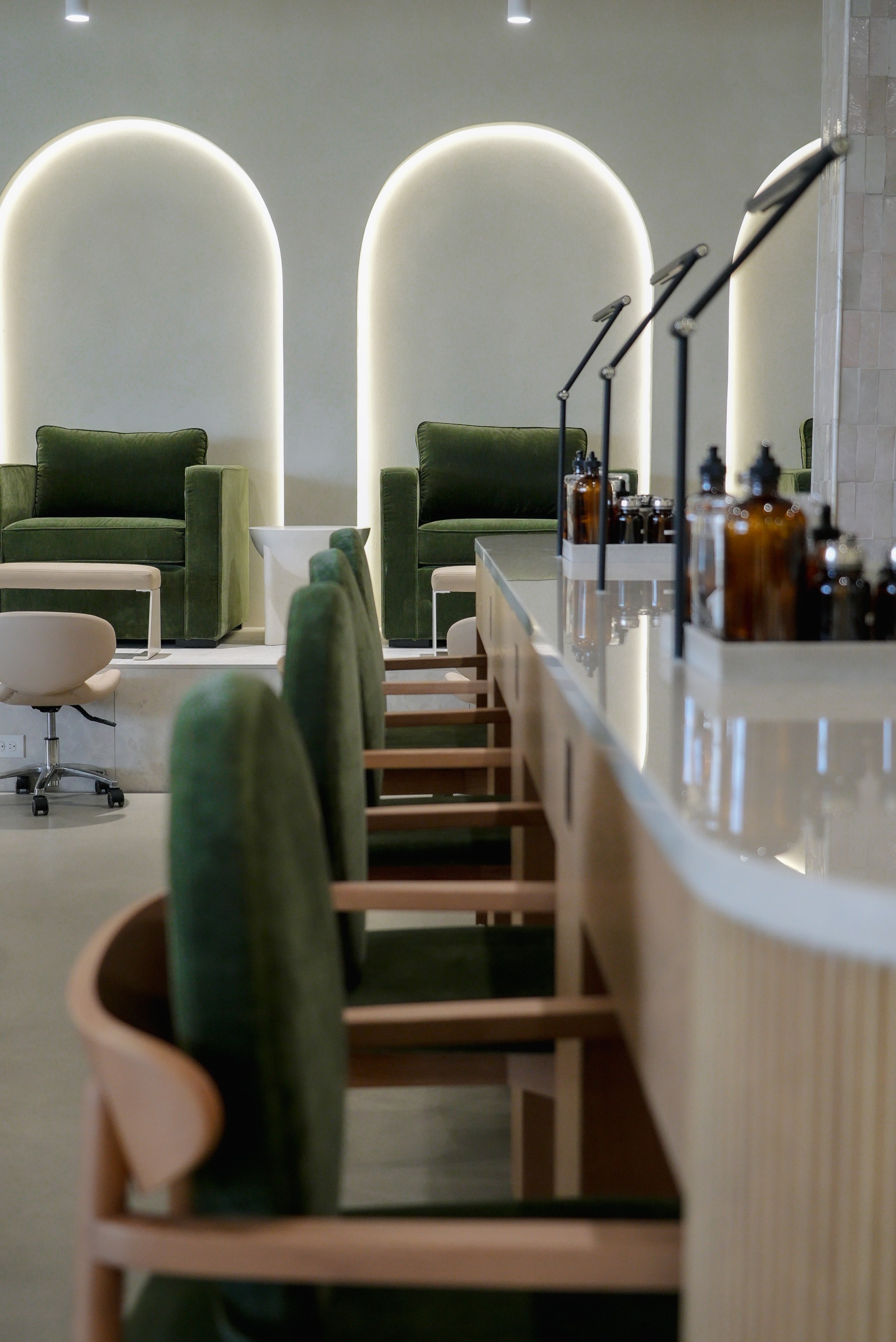 Pedicure seating and product shelving inside the studio