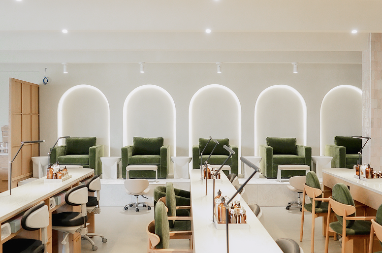Manicure tables and the pedicure lounge at Earth Nail Spa