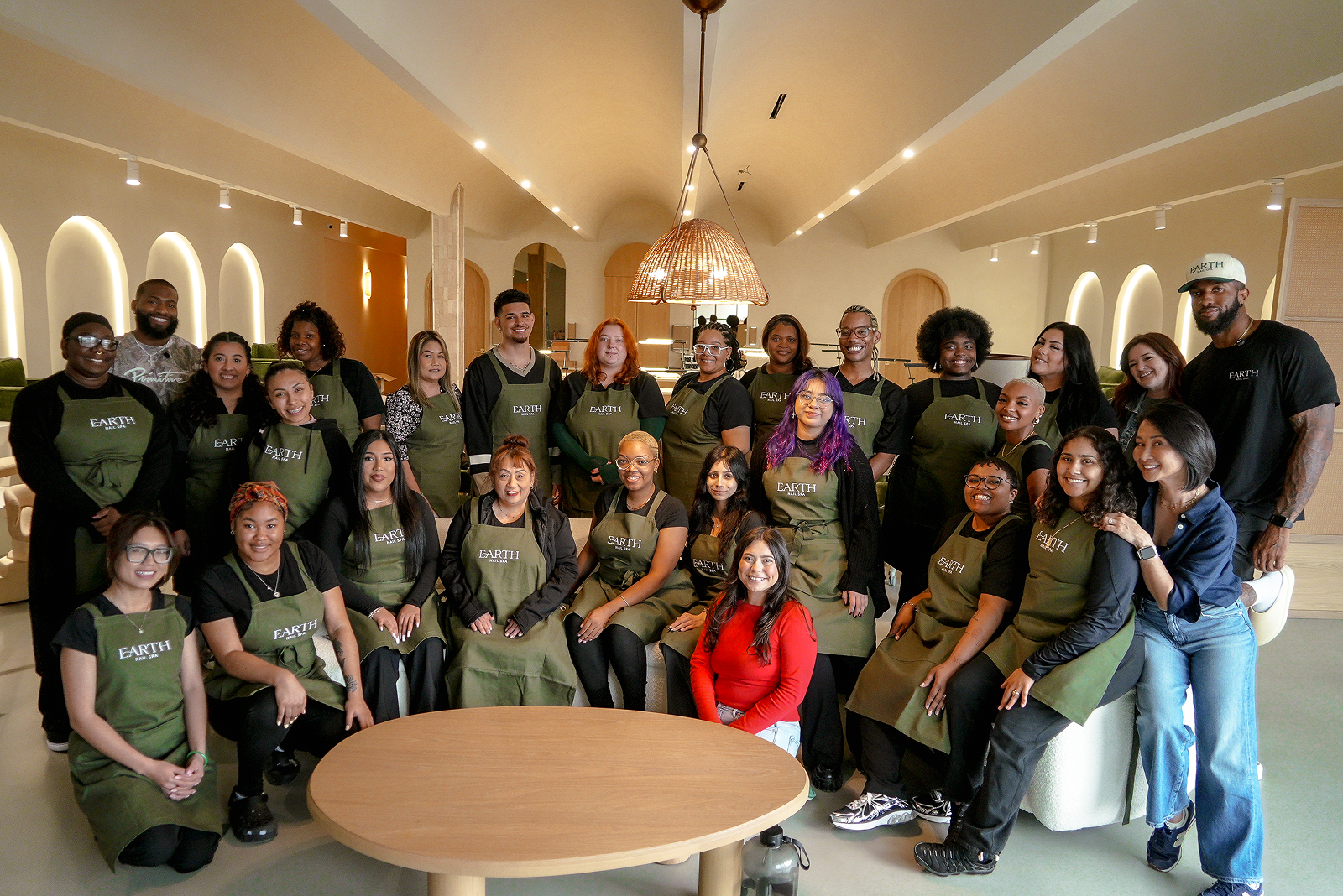 The Earth Nail Spa team in branded aprons