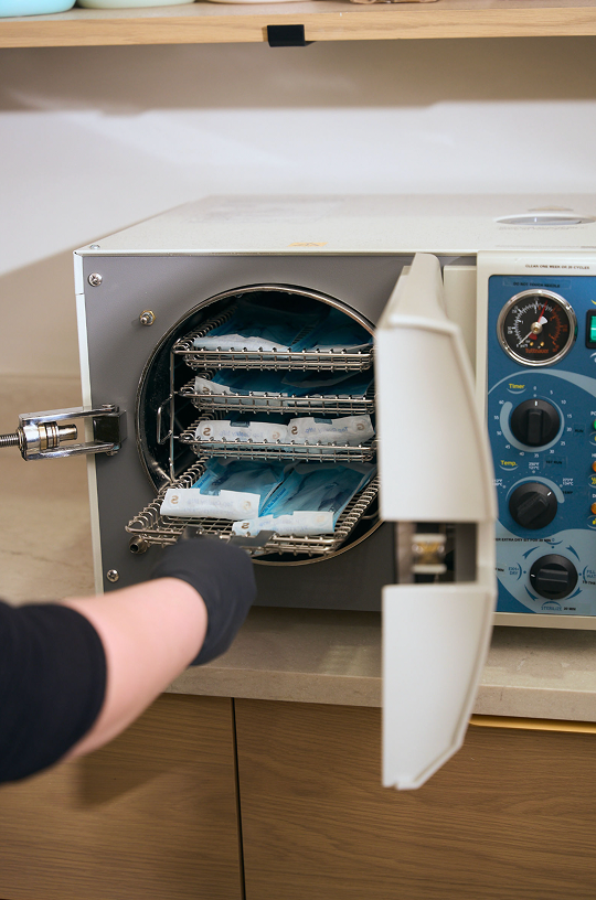 Tools being sterilized in the salon's autoclave